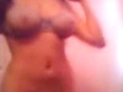 Mature brunette with big boobs stripping naked