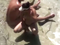 Nude woman refreshing in the water