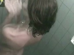 Slender brunette gets caught on cam in the shower